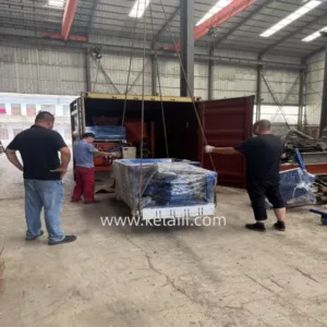 Precast concrete machinery is loaded into containers.